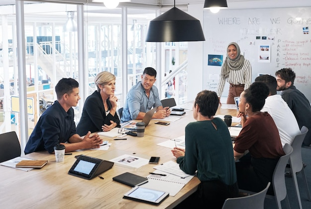 employees having a meeting in an office