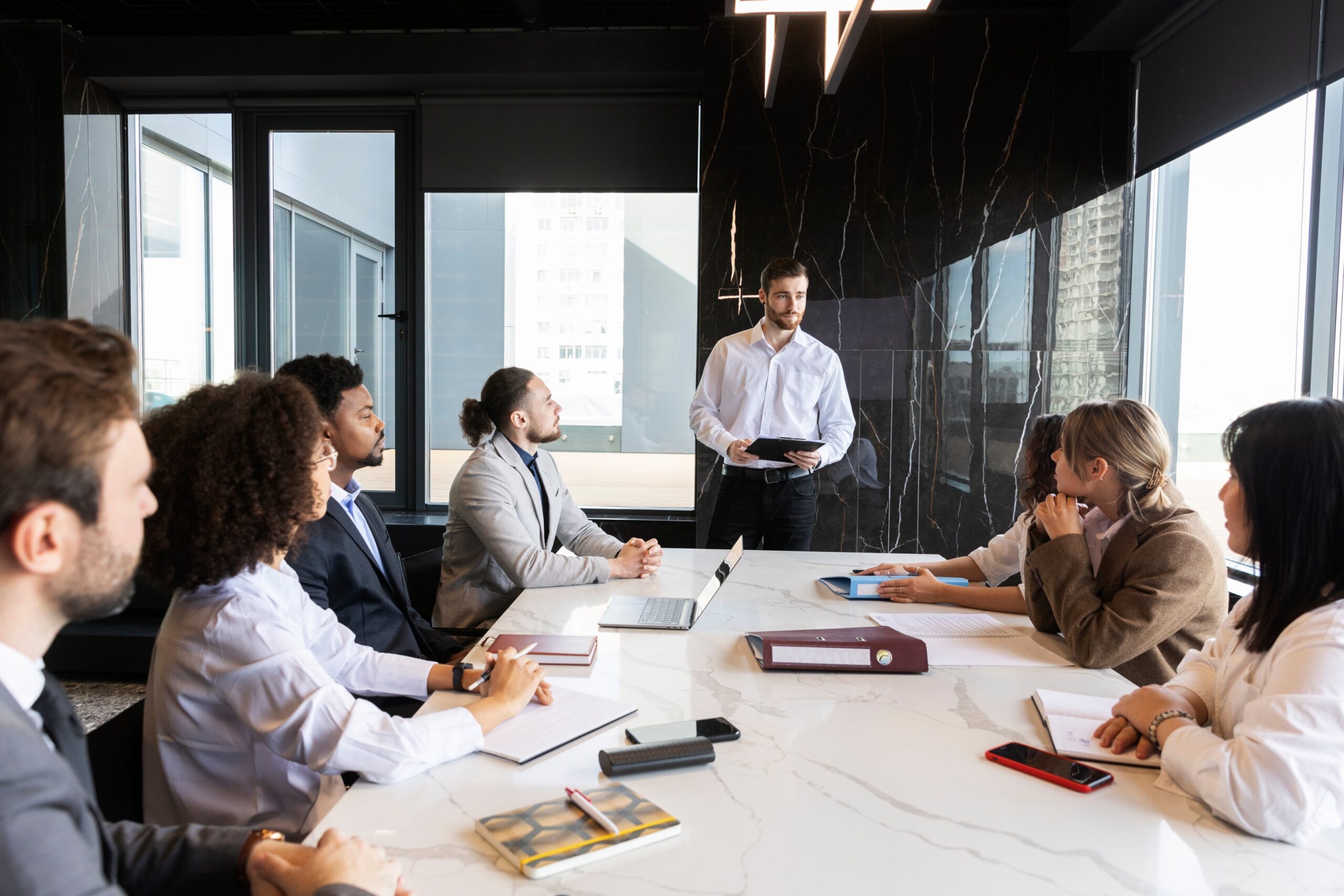 A group of people having a meeting in a conference room