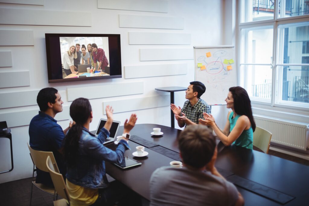 People seated at a conference table in a conference room